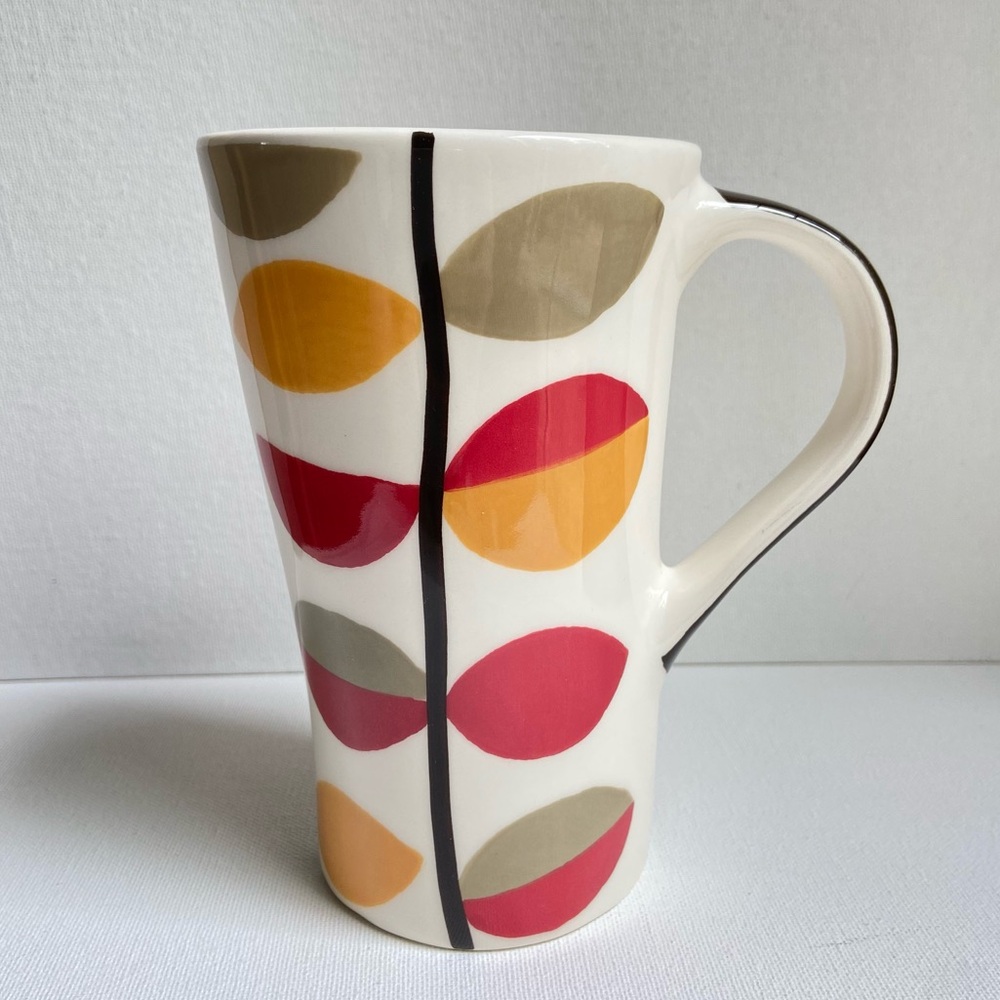Pier 1 tall asymmetrical oval coffee mug with abstract fall leaves and stripes